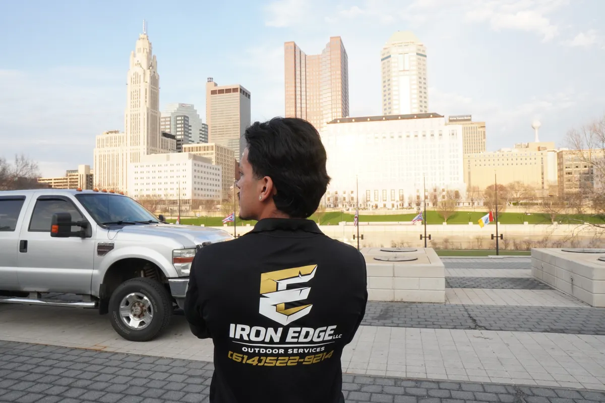 Edgar Munoz Iron Edge Outdoor Services jacket with Columbus skyline