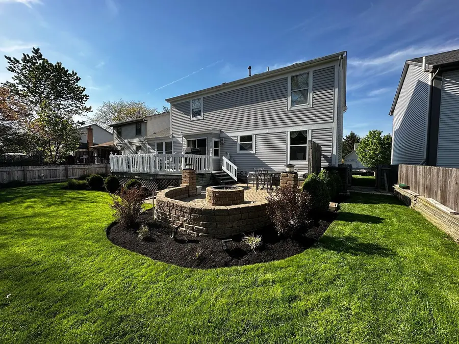 Stone fire pit and outdoor living space by Iron Edge Columbus OH