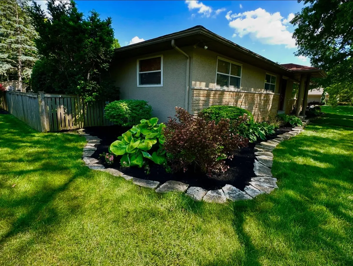 Stone garden bed with shrubs, Columbus OH by Iron Edge Outdoor